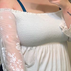 White blouse with flower accents